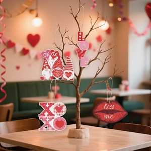 Valentine's Day wooden gnome and heart ornaments hanging on branches for party decor