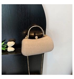 Champagne gold glitter evening clutch with metal handle and sparkling rhinestone clasp