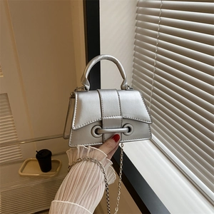 Silver hourglass handbag with metallic PU finish and chain strap for shoulder wear