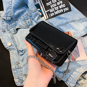 Fashionable black faux crocodile skin crossbody bag with chunky silver chain strap for women