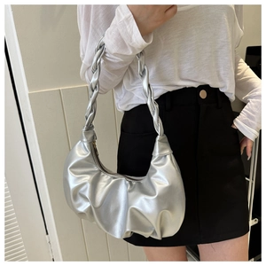 Silver metallic pleated hobo bag featuring a distinctive thick braided shoulder strap