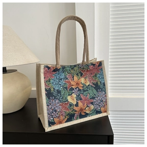 Detailed view of the vintage floral woven pattern on this spacious linen tote handbag