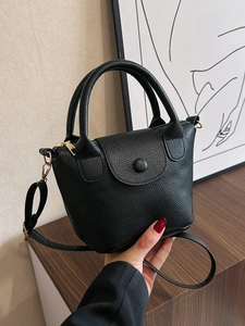 Chic black lychee grain PU leather mini bucket bag with gold hardware and top handle