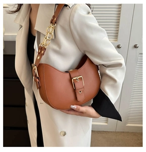 Brown half-moon underarm bag with matte PU leather and elegant gold chain detail