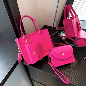 Three-piece hot pink quilted tote bag set with mini coin purse and small crossbody bag
