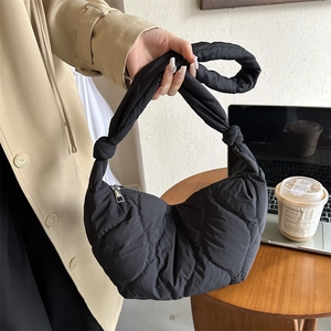 Chic black quilted nylon dumpling bag with trendy knot shoulder strap for women