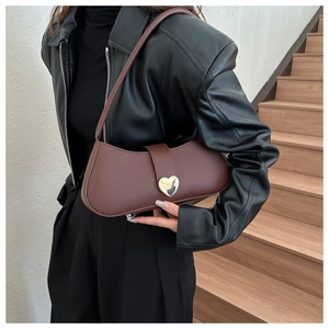 Brown underarm bag featuring a vintage half-moon design and gold heart-shaped metal clasp