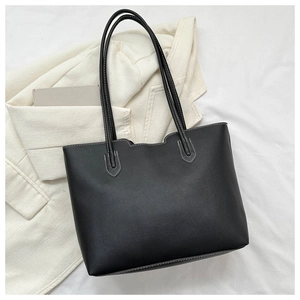 Classic black leather tote bag with contrast stitching and large capacity for daily use