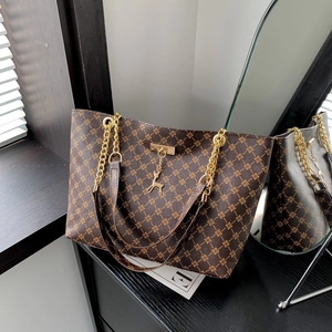 Classic dark brown tote bag with gold geometric pattern and delicate deer pendant