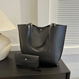 Black large capacity tote bag set with matching pouch in grainy faux leather