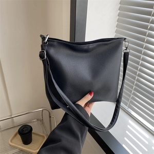 Classic black litchi pattern leather bucket bag with silver hardware for daily wear