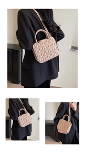 Detailed views of a beige quilted crossbody bag with ring handles and adjustable strap