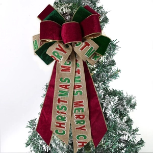 Red and green velvet Christmas tree bow with Merry Christmas lettering on jute tails