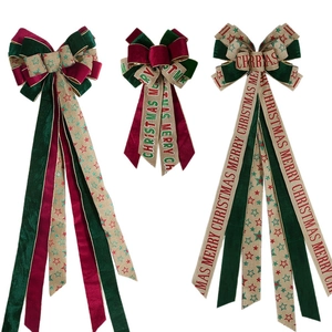 Large red and green velvet Christmas bows with Merry Christmas stars and burlap ribbons