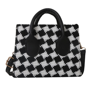 Classic black and white checkered tweed handbag with elegant black PU handles and gold hardware