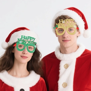 Glittery Happy New Year glasses in gold and green for festive party photo props