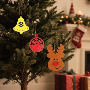 Three-piece felt Christmas ornaments featuring reindeer, bell, and snowflake on a tree