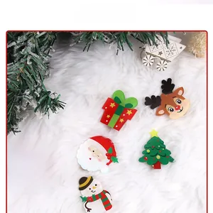 Flat lay of six cute acrylic Christmas hair clips featuring Santa and reindeer on white fur