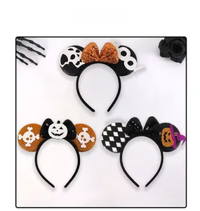 Detailed view of Halloween headbands with sequin bows and spooky festive decorations