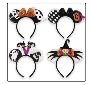 Detail view of four Halloween headbands featuring sequins, pumpkins and festive bows