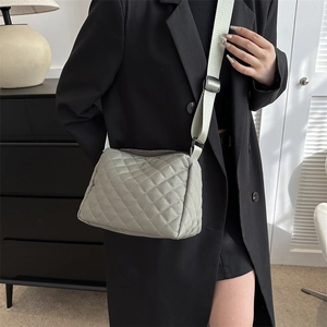 Chic sage green quilted puffer crossbody bag with wide adjustable shoulder strap for women