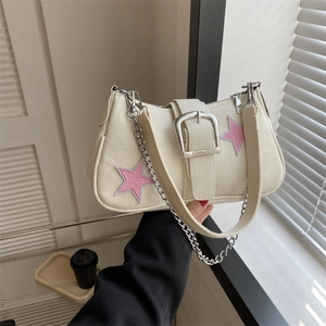 White canvas shoulder bag with pink star patches and metallic chain strap detail