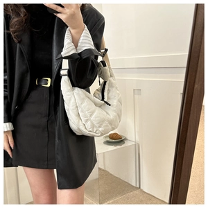 White quilted half-moon shoulder bag with adjustable strap and small detachable coin purse