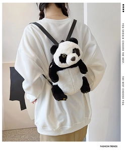 Rear view of a panda plush backpack featuring black and white faux fur and adjustable straps
