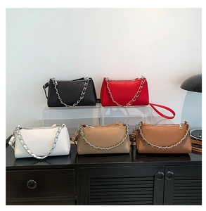 Five stylish faux leather crossbody bags in white, black, red, beige, and brown with chains