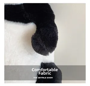 Macro detail of soft black and white plush fabric on the panda shaped backpack