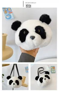 Detail view of small plush panda shoulder bag showing soft faux fur texture and leather strap