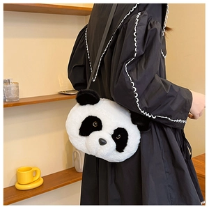 Detailed back view of a plush panda shoulder bag worn by a model in a cozy home setting