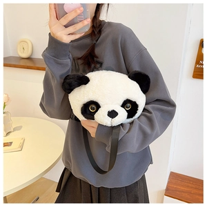 Detail of cute plush panda shoulder bag featuring soft faux fur and adjustable black strap