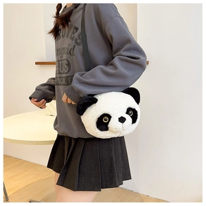 Macro shot of fluffy panda bag showing soft plush texture and golden eye details