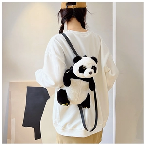 Detail of soft plush panda backpack featuring realistic black and white faux fur texture