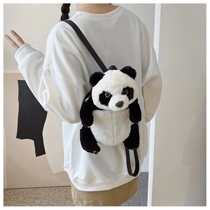 Rear view of a person wearing a soft plush panda backpack with black straps and zipper