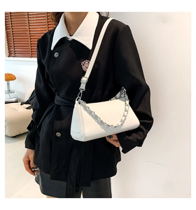 Detailed view of white PU leather underarm bag with silver chain and adjustable shoulder strap