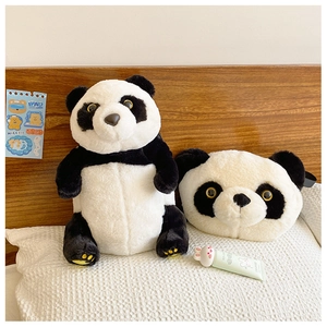 Detail showing plush panda doll and head-shaped crossbody bag on a textured pillow