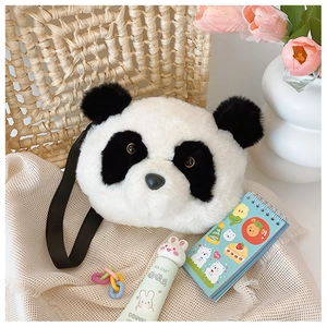 Detail of plush panda head shoulder bag with fluffy texture and adjustable black strap