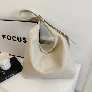 Large capacity beige faux leather hobo bag with textured litchi grain and wide shoulder strap