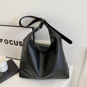 Large black hobo tote bag in litchi grain leather with adjustable strap for women