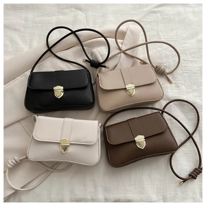 Flache Ansicht von vier Vintage-Klapptaschen in Schwarz, Beige, Cremeweiß und Braun