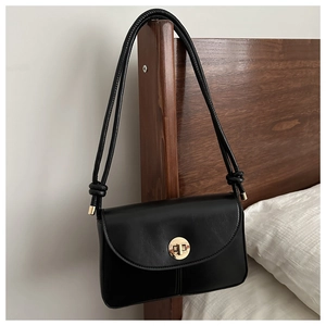 Minimalist black square crossbody bag with round gold twist lock and dual straps