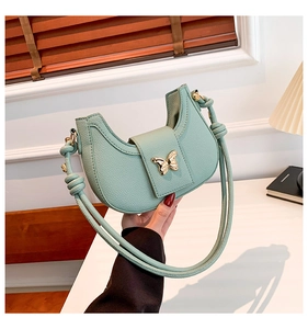 Mint green hobo shoulder bag with litchi grain leather and golden butterfly clasp