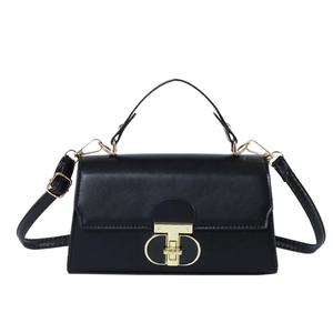 Classic black structured square crossbody bag with gold T-lock and top handle