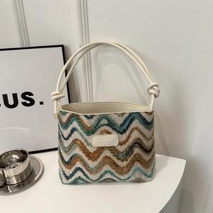 Retro multi-color wave woven bucket bag with elegant cream leather knotted handles