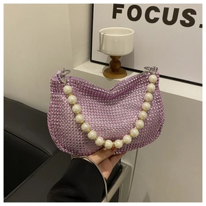 Macro shot of purple rhinestone hobo bag with large faux pearl beaded strap