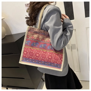Detail view of the ethnic elephant print canvas and jute texture on this large tote bag