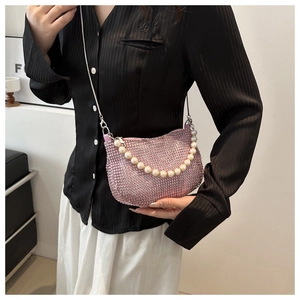 Pink rhinestone crossbody bag featuring a pearl handle and delicate metal chain strap