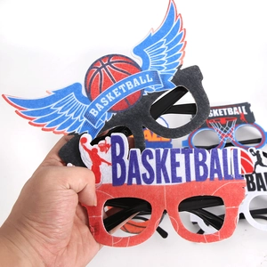 Close-up of basketball party glasses with felt basketball icons and orange player silhouettes